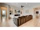 Spacious living room with hardwood floors, built-in shelving, and a fireplace at 11 Morninglow Pass, Henderson, NV 89052