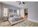 Serene main bedroom with art and a sliding barn door to the bathroom at 11 Morninglow Pass, Henderson, NV 89052