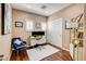 Cozy office with hardwood floors, a white desk, and a comfortable blue chair at 11 Morninglow Pass, Henderson, NV 89052