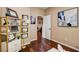 Office featuring hardwood floors, shelving, a desk, and neutral-colored walls at 11 Morninglow Pass, Henderson, NV 89052