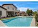 Backyard area featuring a swimming pool, hot tub, patio, and outdoor grill at 11 Morninglow Pass, Henderson, NV 89052