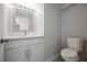 Bathroom featuring new toilet, vanity, and mirror at 111 Pomelo Ct, Henderson, NV 89074