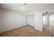 A bright bedroom featuring plush carpeting, neutral walls, and a closet space for ample storage at 111 Pomelo Ct, Henderson, NV 89074