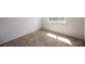 Bedroom with neutral carpet and a large bright window at 111 Pomelo Ct, Henderson, NV 89074