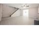 Bright living room featuring wood-look tile, staircase, and neutral color palette at 111 Pomelo Ct, Henderson, NV 89074