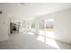 Bright living space with a view to backyard featuring wood-look tile and a sliding glass door at 111 Pomelo Ct, Henderson, NV 89074