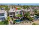 Beautiful backyard with a pool, spa, mature palms, and mountain views at 11359 Winter Cottage Pl, Las Vegas, NV 89135
