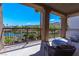 Enjoy the serene water and mountain view from this covered outdoor balcony at 11359 Winter Cottage Pl, Las Vegas, NV 89135