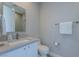 Clean bathroom with modern fixtures, a sleek vanity, and a toilet, offering a minimalist design at 11359 Winter Cottage Pl, Las Vegas, NV 89135