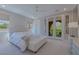 Inviting bedroom with patio access, a neutral palette, and natural light, creating a peaceful retreat at 11359 Winter Cottage Pl, Las Vegas, NV 89135