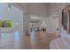 Elegant foyer with high ceilings, wood floors, staircase, and great natural light, seamlessly connecting living spaces at 11359 Winter Cottage Pl, Las Vegas, NV 89135