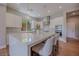 Bright, modern kitchen with large center island and seating, high-end appliances, and elegant finishes at 11359 Winter Cottage Pl, Las Vegas, NV 89135