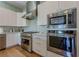 Kitchen showcasing stainless steel appliances including a KitchenAid oven, microwave, and gas range cooktop at 11359 Winter Cottage Pl, Las Vegas, NV 89135