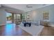 Sun-filled living room features an open floor plan and seamless indoor-outdoor living with a patio view at 11359 Winter Cottage Pl, Las Vegas, NV 89135