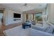 Bright living room features modern furnishings and a seamless transition to the outdoor living space at 11359 Winter Cottage Pl, Las Vegas, NV 89135