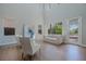 Bright living room with high ceilings, large windows, and stylish furnishings at 11359 Winter Cottage Pl, Las Vegas, NV 89135