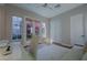 Bright office with a modern ceiling fan, windows and glass patio doors overlooking a quaint outdoor space at 11359 Winter Cottage Pl, Las Vegas, NV 89135
