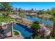 Inviting backyard pool overlooking the serene lake and lush greenery, a perfect outdoor oasis at 11359 Winter Cottage Pl, Las Vegas, NV 89135