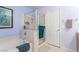 This bathroom features a separate shower and tub with light blue walls and tile flooring at 11739 Village Arbor St, Las Vegas, NV 89183