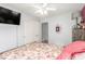 Light gray walls allow the natural light to fill this bedroom with a plush carpet and walk in closet at 11739 Village Arbor St, Las Vegas, NV 89183