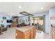 Kitchen with tile countertops and an open floorplan to a large living area at 11739 Village Arbor St, Las Vegas, NV 89183