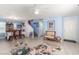 Inviting living and dining area with light blue walls, wood-look flooring, and stylish furnishings at 11739 Village Arbor St, Las Vegas, NV 89183