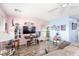 Living room featuring light pink and blue walls, wood floors and natural light from two windows at 11739 Village Arbor St, Las Vegas, NV 89183