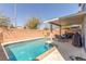 Private backyard pool with a covered patio area, perfect for outdoor entertaining at 11739 Village Arbor St, Las Vegas, NV 89183