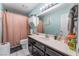 Bathroom features an extended counter, hanging cabinet, and shower at 120 N Phyllis St, Las Vegas, NV 89110