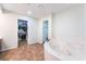 Bathroom with a soaking tub, double sinks, walk-in closet, and private toilet area provides convenience and comfort at 120 N Phyllis St, Las Vegas, NV 89110
