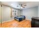 Bedroom features light gray walls, hardwood floors, and a ceiling fan at 120 N Phyllis St, Las Vegas, NV 89110