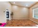 Open bonus room with hardwood floors, providing endless possibilities for creating a versatile and inviting space at 120 N Phyllis St, Las Vegas, NV 89110