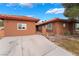 Charming home featuring a terracotta roof, a long driveway, and a well-maintained exterior at 120 N Phyllis St, Las Vegas, NV 89110