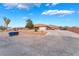 Attractive home boasts a spacious driveway, desert landscaping, and convenient parking at 120 N Phyllis St, Las Vegas, NV 89110