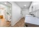 Bright laundry room features tile floors, white cabinets, utility sink, and washer/dryer at 120 N Phyllis St, Las Vegas, NV 89110