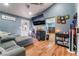 Living room with hardwood floors, couch, and TV on the wall at 120 N Phyllis St, Las Vegas, NV 89110