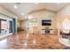 Spacious living room boasts wood floors, a vaulted ceiling, and abundant natural light at 120 N Phyllis St, Las Vegas, NV 89110