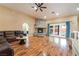 Comfortable living room with a stone fireplace, wood floors, and plenty of seating at 120 N Phyllis St, Las Vegas, NV 89110