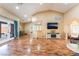 Spacious living room boasts wood floors, a vaulted ceiling, and abundant natural light at 120 N Phyllis St, Las Vegas, NV 89110