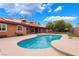 Backyard pool featuring attached spa and solar panels on the home's tile roof at 120 N Phyllis St, Las Vegas, NV 89110