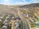 Serene aerial view of a desert community near mountains with a tranquil river landscape in the background at 14 Parco Fiore Ct, Henderson, NV 89011