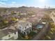 Beautiful backyard with a manicured lawn, patio seating, landscaping, and a private pool at 14 Parco Fiore Ct, Henderson, NV 89011