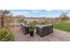 Cozy backyard patio featuring comfortable seating, manicured lawn, and mountain views at 14 Parco Fiore Ct, Henderson, NV 89011