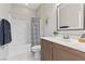 Well-lit bathroom featuring a shower-tub combo with a stylish vanity and decorative accents at 14 Parco Fiore Ct, Henderson, NV 89011