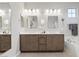 Bright bathroom featuring double vanity, soaking tub and modern fixtures at 14 Parco Fiore Ct, Henderson, NV 89011
