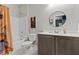 Clean bathroom featuring a shower-tub combo, toilet and single sink vanity at 14 Parco Fiore Ct, Henderson, NV 89011