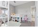 bedroom with lofted bed, vanity, shelving, and decor and neutral colors at 14 Parco Fiore Ct, Henderson, NV 89011