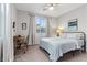 Cozy bedroom with a ceiling fan, decorative art and a metal frame bed at 14 Parco Fiore Ct, Henderson, NV 89011