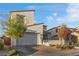 Contemporary two-story home with a two-car garage and desert landscaping at 14 Parco Fiore Ct, Henderson, NV 89011