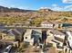Beautiful two-story home with a desert landscape and mountain views under a bright blue sky at 14 Parco Fiore Ct, Henderson, NV 89011